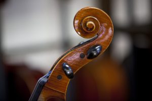 Violin players are critical to orchestras supported by booster clubs