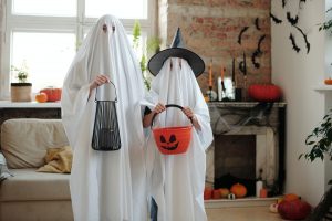 Halloween ghosts and their trick or treat buckets