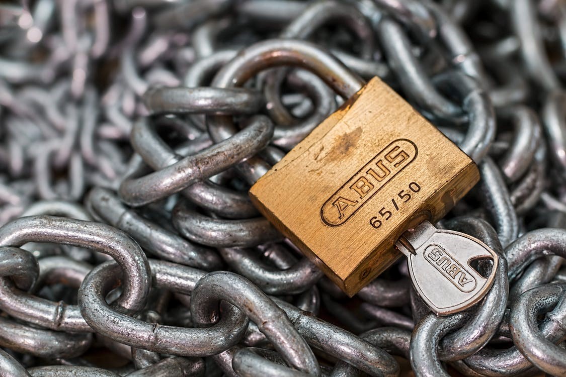 A lock and chains used as a metaphor for secure online cloud storage.